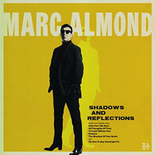 Yellow album cover featuring Marc Almond in a dark suit, standing against a shadow.