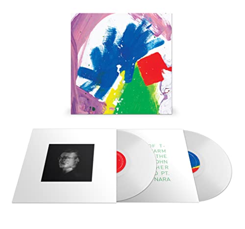 Vinyl record set with abstract colorful cover art, black and white sleeve, and discs.