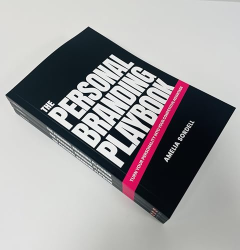 Black book titled "The Personal Branding Playbook" stacked with others.