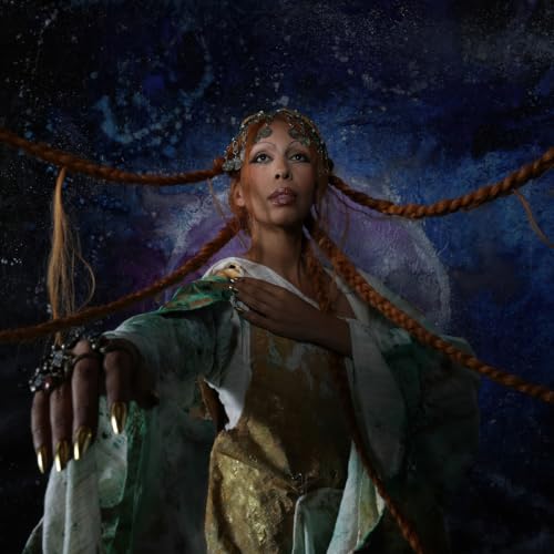 A person with long braided hair and gold nails poses against a cosmic background.