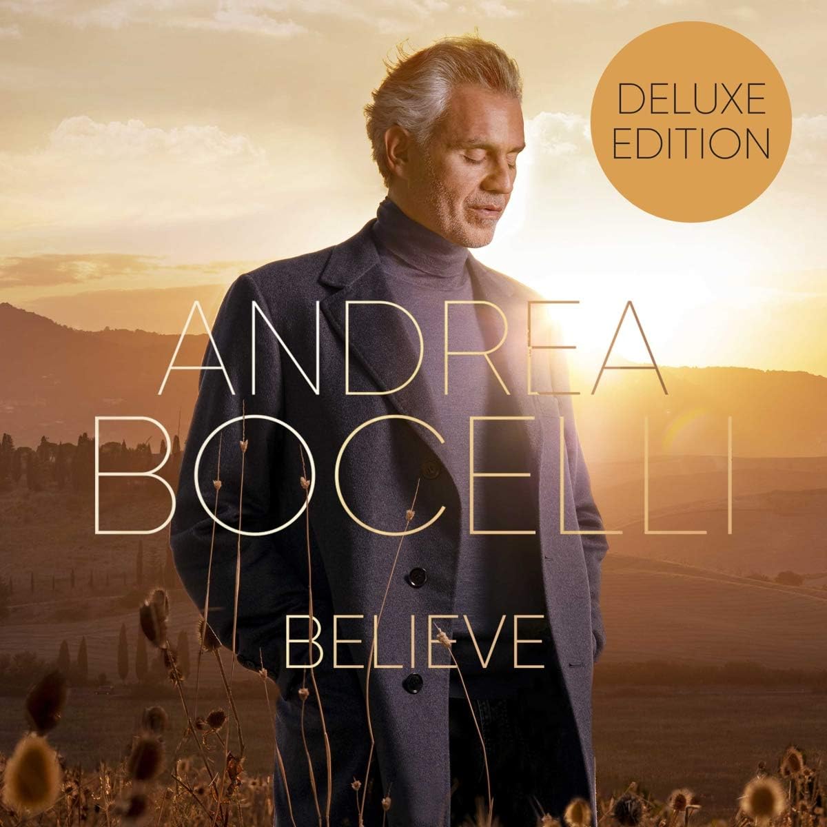 Andrea Bocelli “Believe” CD cover with portrait and golden landscape.