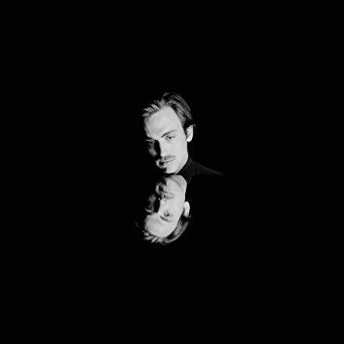 Black and white portrait of Andrew Combs with a distorted reflection.