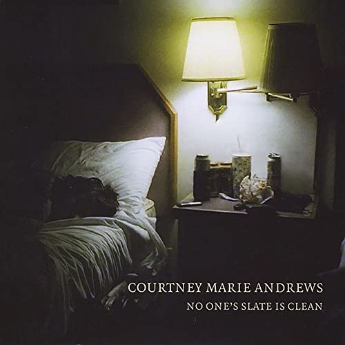 CD cover: dimly lit bedroom scene with a lamp and bedside table.