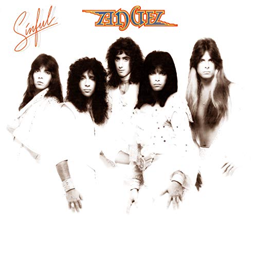 Black and white photo of a 1980s rock band, album cover.