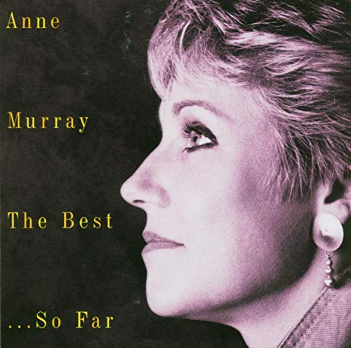 Black and white profile photo of Anne Murray with short hair and pearl earrings.