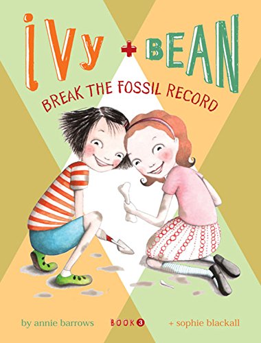 Book cover: two girls crouching, examining a fossil bone.