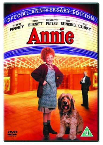 DVD cover for "Annie" featuring a young girl, dog, and man.