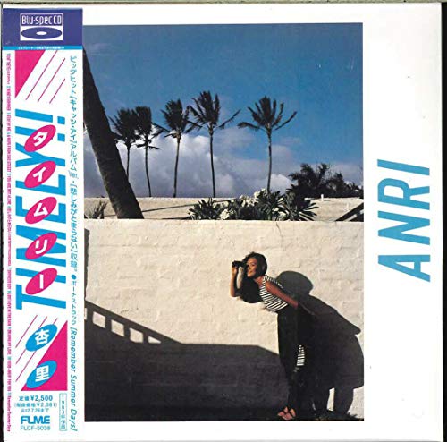 CD cover for Anri’s “Timely!!” featuring a woman by palm trees.