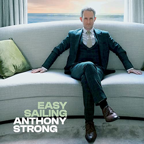 Anthony Strong album cover: man in suit on a white couch.