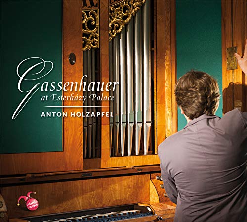 CD cover: organ pipes, musician's back, and ornate wooden cabinet.