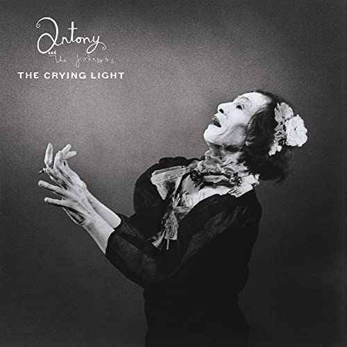 Black and white album cover featuring a person with a floral headpiece.