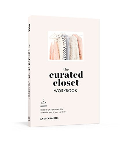 Pale pink workbook cover with clothes illustration and black text.