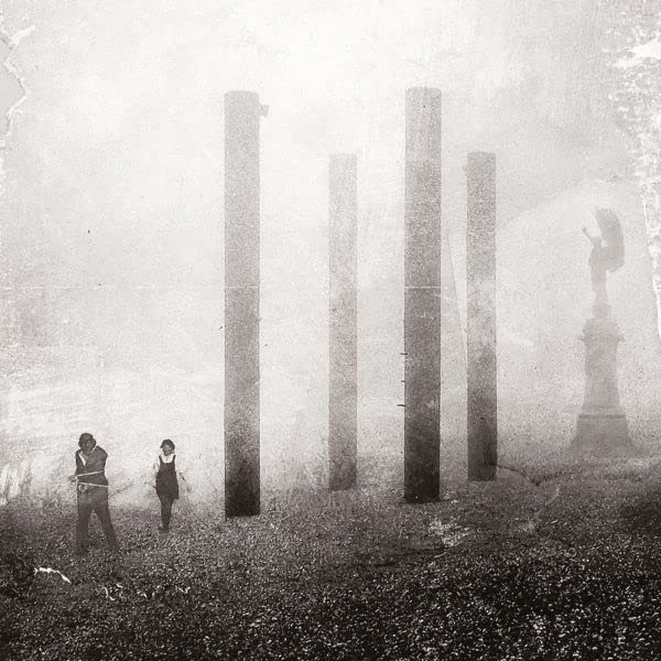 Black and white album cover with figures among ruined columns.