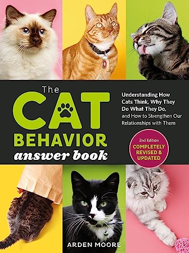 Book cover featuring multiple cats, titled “Cat Behavior Answer Book, 2nd Edition.”