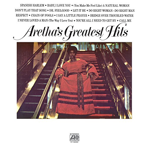 "Album cover featuring Aretha Franklin in red dress on a staircase."