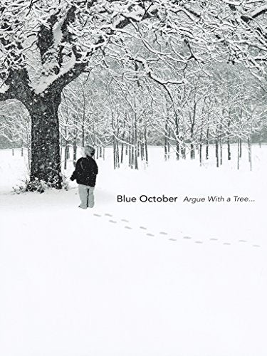 Snowy winter scene with a child facing a large, snow-covered tree.