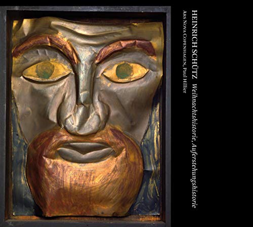 CD cover featuring a weathered, expressive wooden mask with text.