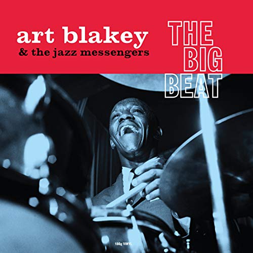 Art Blakey album cover featuring drummer playing, red and blue tones.