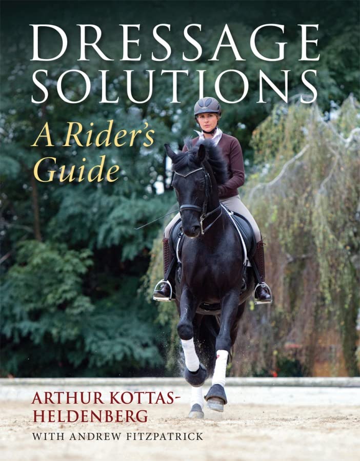 Book cover: rider on a black horse in a dressage pose.