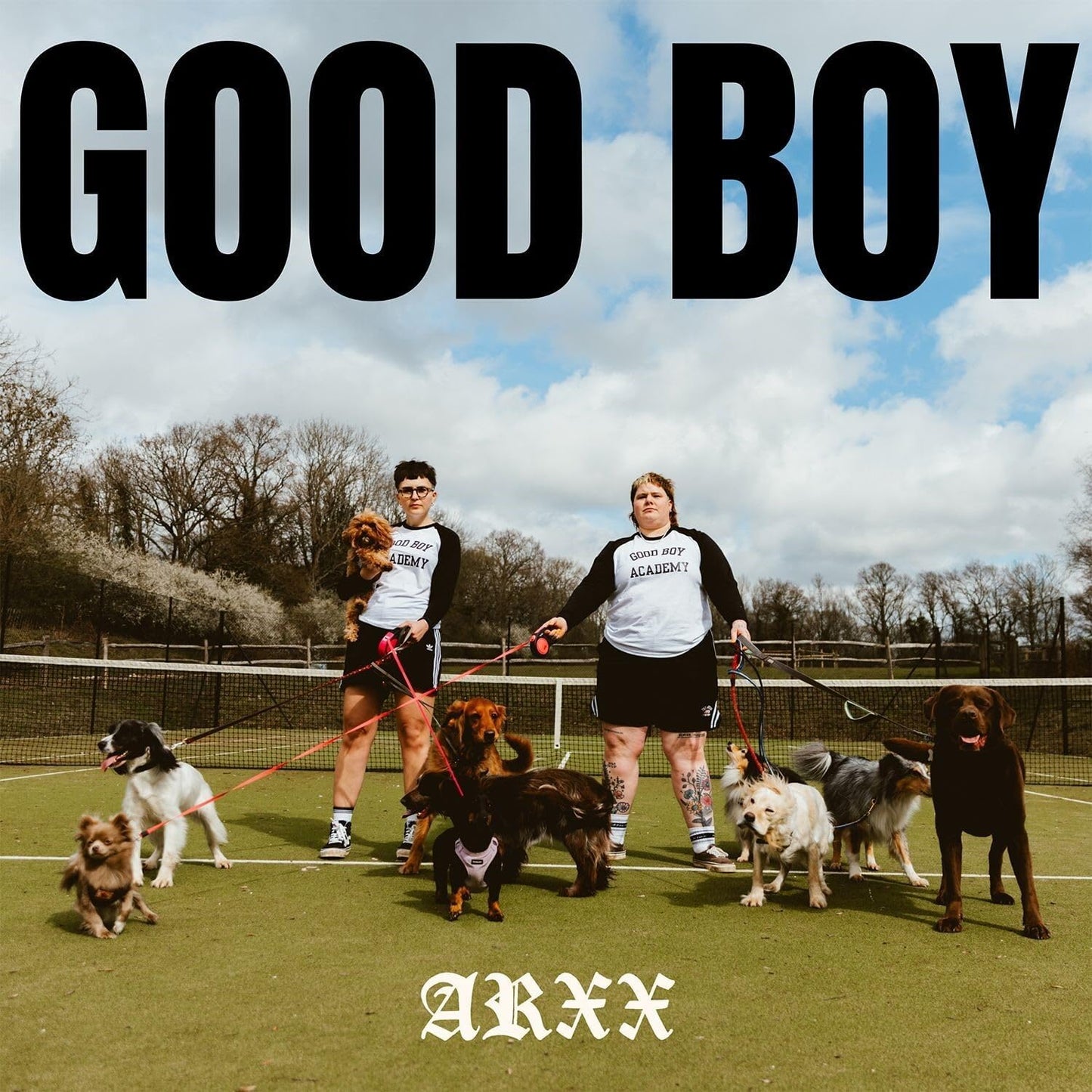 CD cover for Arxx’s “Good Boy” featuring people with dogs on a tennis court.