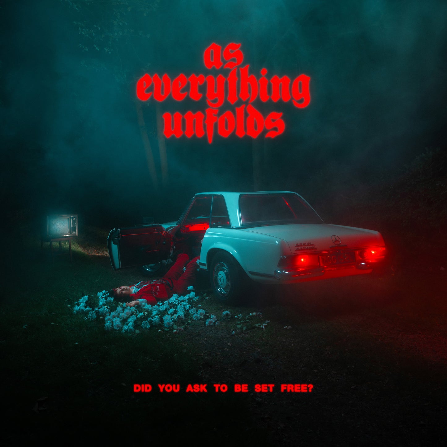 Album cover with red neon text, a car, and a figure in a foggy landscape.