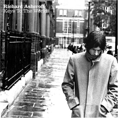 Black and white album cover featuring Richard Ashcroft on a city street.