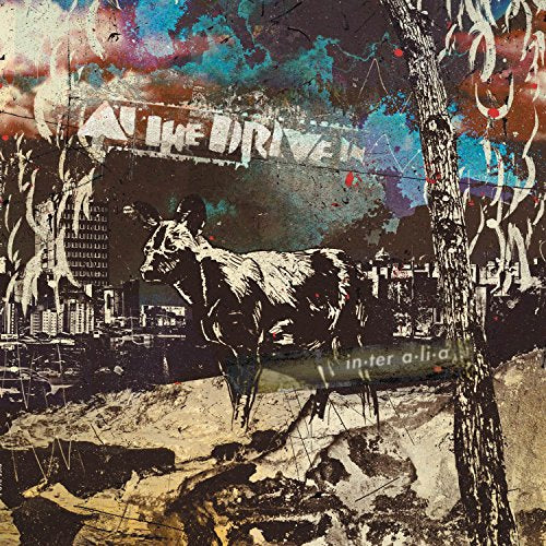 Album cover of "At The Drive - in.ter a.li.a" featuring abstract art with a cow.