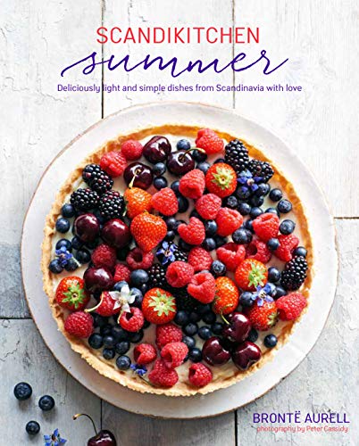 Cookbook cover featuring a colorful fruit tart on a white wood surface.
