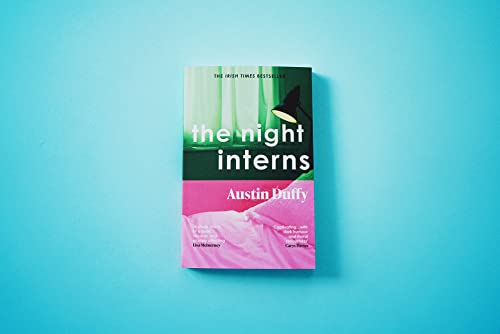 Book cover for "The Night Interns" with a lamp and pink bedding.