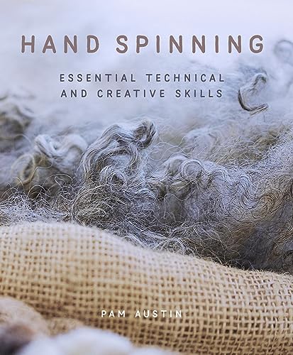 Book cover with wool fleece and the title "Hand Spinning.