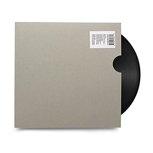 A plain grey vinyl record sleeve with a barcode sticker and exposed black disc.
