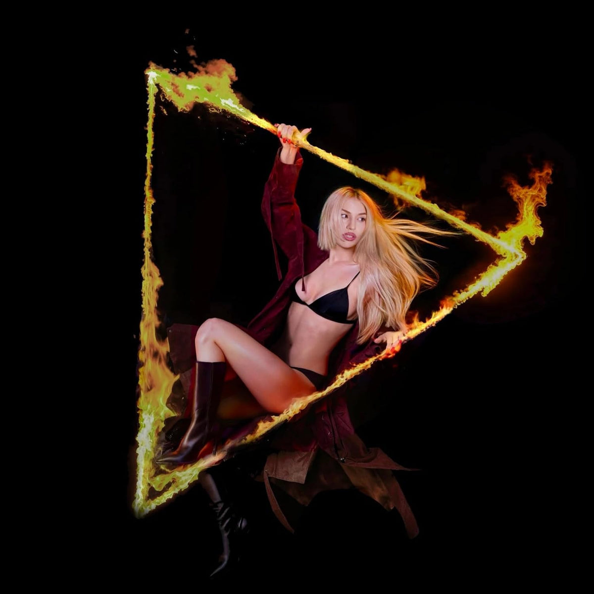 Ava Max posing within a fiery, triangular play button frame.