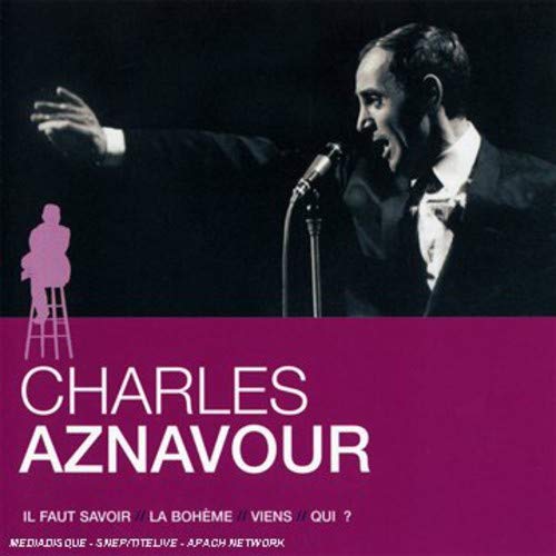 Charles Aznavour singing into a microphone, album cover with purple background.