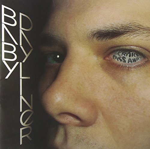 Close-up of a man's face with text inB Baby Dayliner and Critics Pass Away.