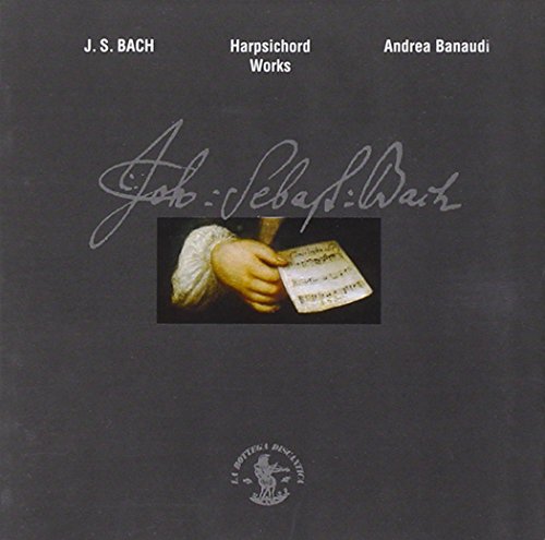 CD cover: Bach’s signature, hand holding sheet music, dark background.