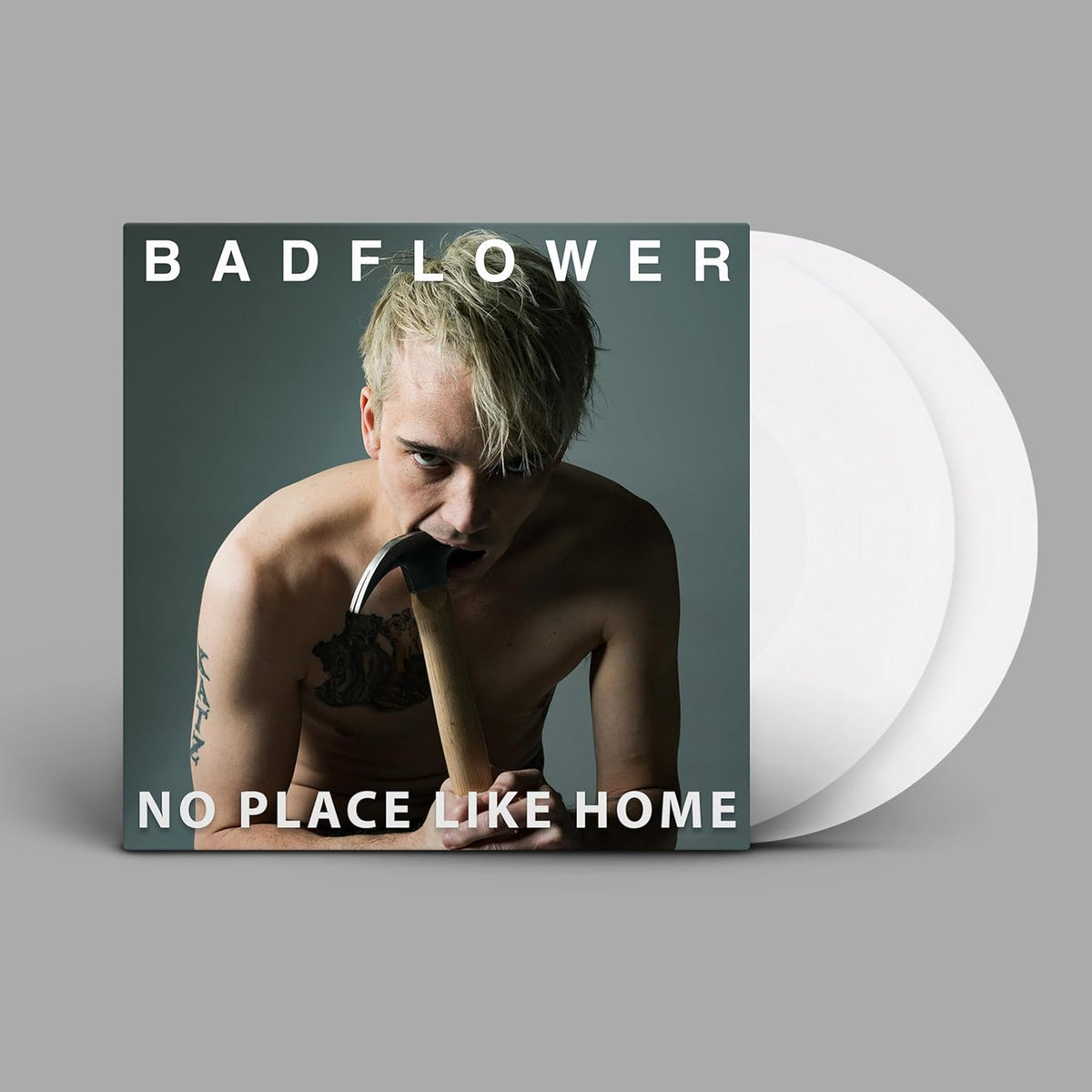 Badflower album cover with a man and vinyl record shown.
