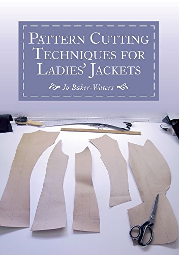 Book cover with jacket pattern pieces, ruler, and scissors.