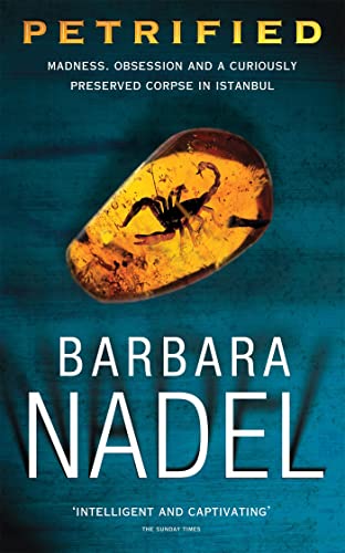 Book cover: "Petrified" by Barbara Nadel, featuring a scorpion in amber.