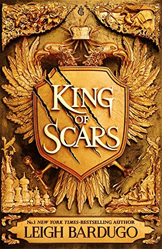Book cover: “King of Scars” with golden shield, wings, and crown imagery.