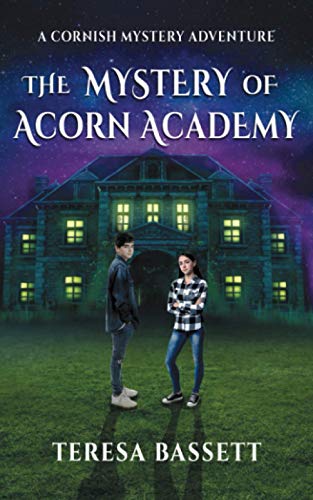 A boy and girl stand before a large, dark, illuminated stone building at night.