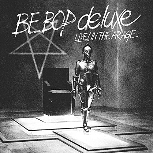 Black and white album cover featuring a female robot and a glowing pentagram.