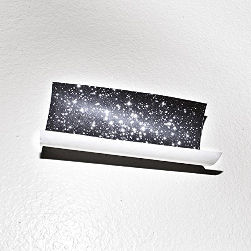 Vinyl record in white sleeve with a dark, starry cover.