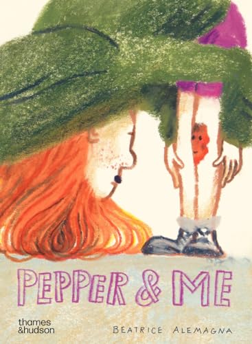 A person with red hair and a green hat looks at a small creature.