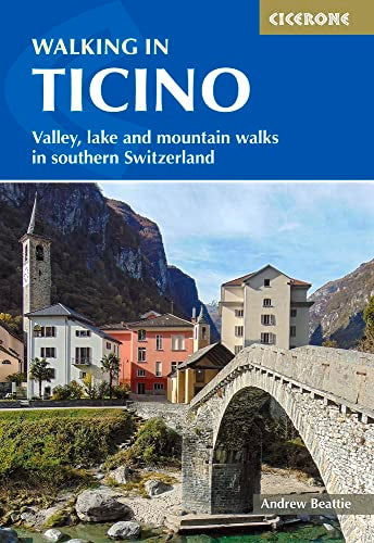 Cover of “Walking in Ticino” guidebook, showing a Swiss village and mountains.