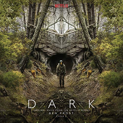 A hooded figure stands before a dark cave entrance in a symmetrical forest landscape.