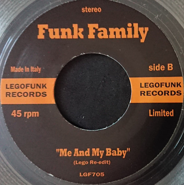 Close-up of a dark brown 7-inch vinyl record label with orange text.