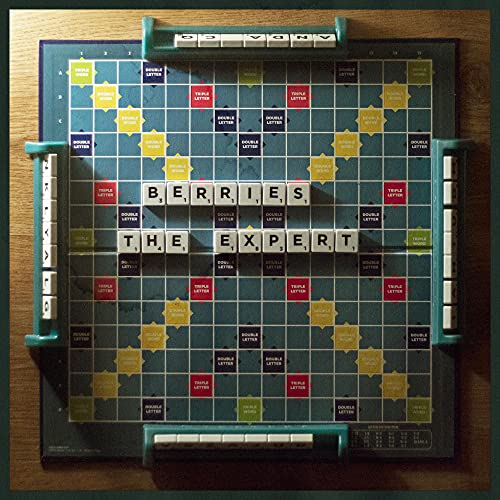 Scrabble board spelling "BERRIES - The Expert" with letter tiles.