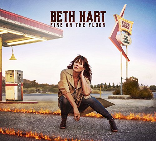 Beth Hart album cover featuring a woman crouching near a gas station.