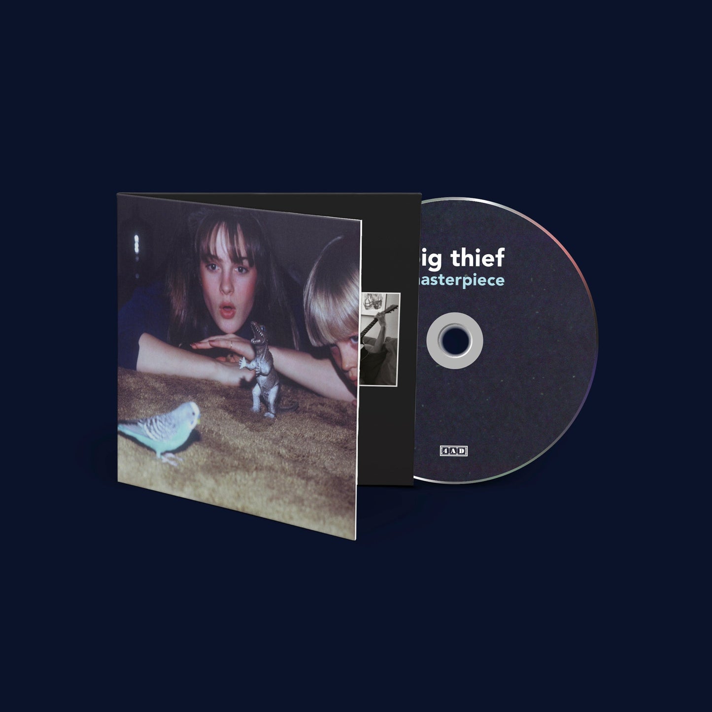 Big Thief’s “Masterpiece” CD case and disc with portrait and animals.