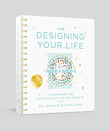 White spiral-bound workbook titled “The Designing Your Life Workbook.”
